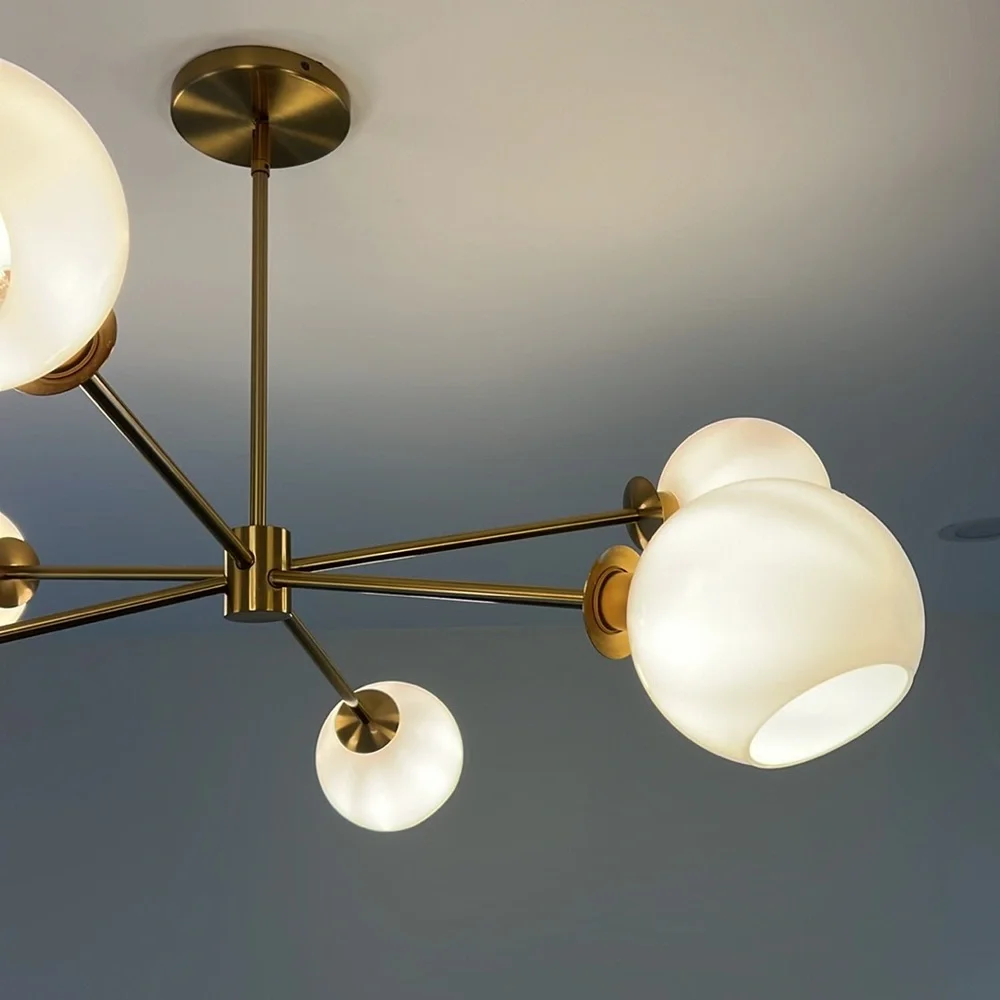 This beautiful and chic west elm designer chandelier, comes equipped with bulbs